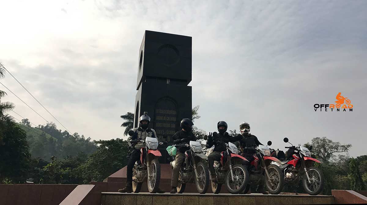 Ho Chi Minh Trail Motorbike Voyage - Vietnam Motorbike Rental at a monument